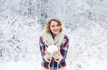 Fototapeta premium Happiness. Exciting winter photoshoot ideas. Snowflakes are tiny crystals. Snow games. Winter outfit. Snow makes everything outdoors look amazing. Woman warm clothes snowy forest. Nature covered snow