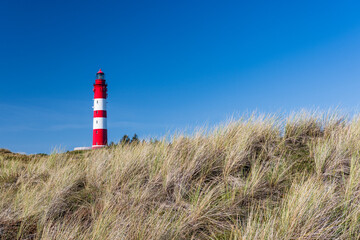 Fototapeta na wymiar Amrum lighthouse. Amrum is one of the North Frisian Islands on the German North Sea coast