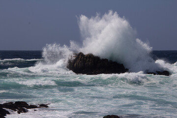 waves crashing on rocks