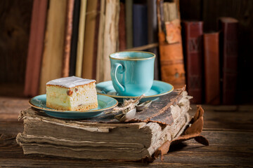 Cheesecake served with coffee in blue porcelain