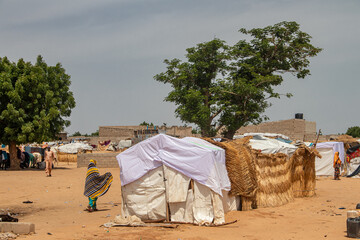 Refugee camp in Africa, full of people who took refuge due to insecurity and armed conflict. People living in very poor conditions, lack of food, clean water and proper shelter to stay in