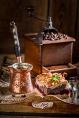 Hot cherry pie with coffe grinder and grains
