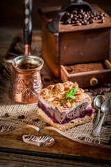 Fototapeta na wymiar Tasty and homemade cherry pie with pot boiled coffee