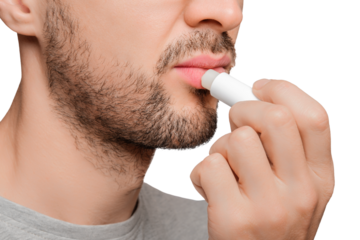 Cropped shot of an unrecognizable man applying lip balm, chapstick on his lips. Close up.