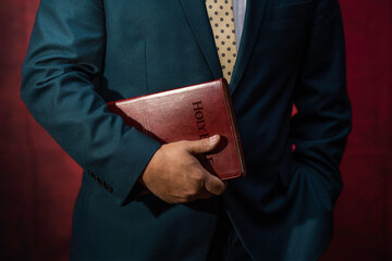 Evangelical Pastor Holding The Holy Bible - 542526589
