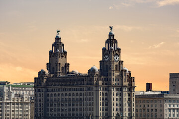 Fototapeta na wymiar The famous Royal Liver Building as seen from New Brighton across the River Mersey. The two Liver Birds can be seen on top of the building