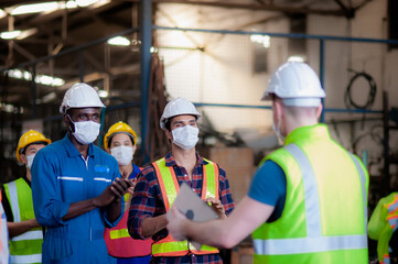 Group of diversity technician, foreman and engineer are happy and standing ovation to congratulate companies that still working and pay wages to employees employees during covid-19 outbreak.