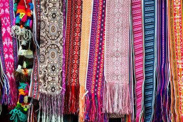 Colorful fabric belts in the artisan's market in Cuenca, Traditional patterns and design of Ecuador