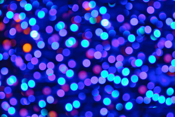 Christmas background with bokeh of colored lights.