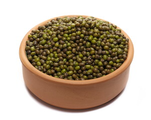 Organic raw green beans mungo in clay pot isolated on white, top view