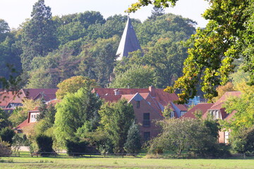 church spire in small village in autumn
