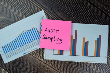 Concept of Audit Sampling write on sticky notes isolated on Wooden Table.