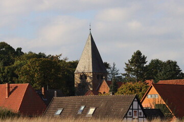 Fototapeta na wymiar church spire in small village in autumn