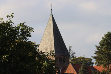 church spire in a small village in autumn clear sky