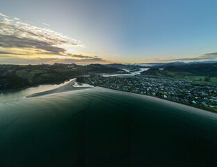 Fototapeta na wymiar First light over Cooks Beach, Coromandel Peninsula in New Zealand's North Island