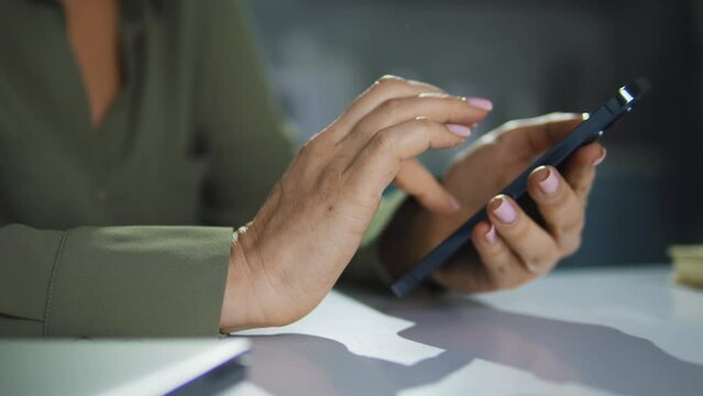 Lady scrolling web-pages on smartphone, checking bank account, shopping online