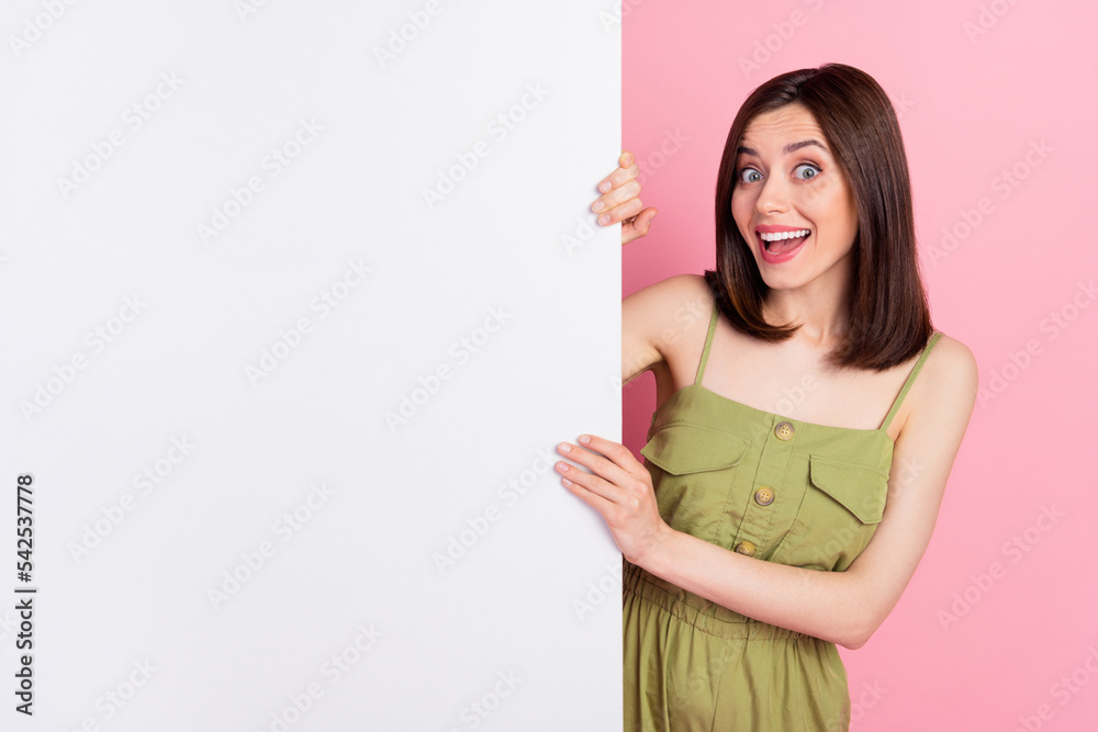 Sticker Photo of impressed positive lady hand hold empty space white wall demonstrate promo spa salon isolated on pink color background