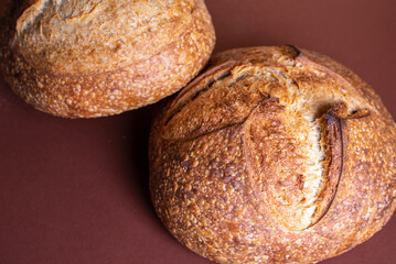 Sourdough breads with crispy crust on table. Bakery goods