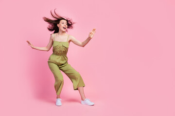 Fototapeta na wymiar Full length photo of cheerful girl energetic active person look empty space kung fu isolated on pink color background