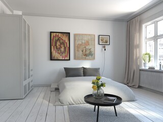 Modern comfortable bedroom with a large stylish bed and a white background.	