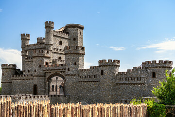 Summer sunny day. Against the backdrop of the blue sky, the outlines of an ancient fortress,...