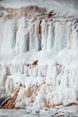 Fototapeta na wymiar freezing waterfall on the rock
