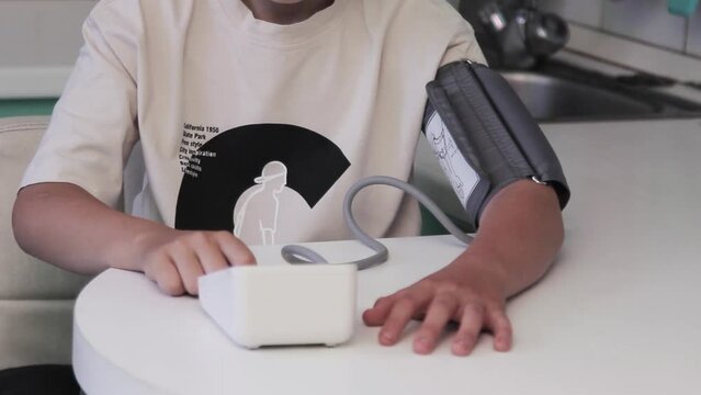 Close up heart rate monitor measures the pulse of a young guy