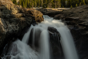 Water Cascades Down Rocky Cliff in The Tuolumne River