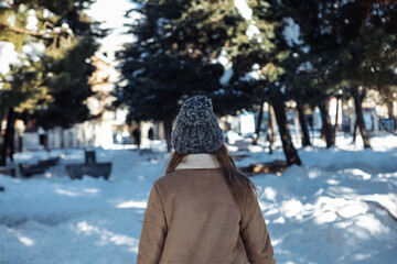 girl walking in winter park