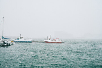 Fototapeta na wymiar Boats floating on rippling sea