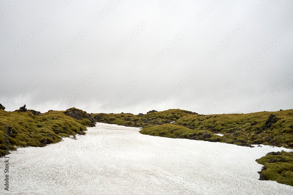 Sticker Rocks and snow against gray sky