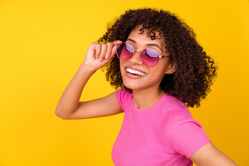 Photo of sweet brunette lady hand glasses wear crop top isolated on vivid orange color background