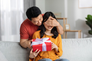 Loving man making surprise for St. Valentines Day or birthday