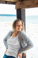 young beautiful girl on the coast in winter