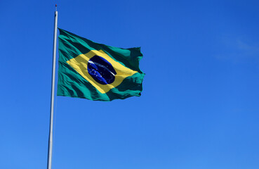 salvador, bahia, brazil - october 30, 2022: Brazilian flag seen on a flagpole of a supermarket in the city of Salvador.