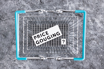 inflation or price gouging text with shopping basket representing prices going up, economy after...