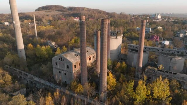 Abandoned old production plant, cement plant in Bedzin, Grodzisk, Poland. Concept of abandoned places, industrial ruins, urbex. View from the drone, air.
