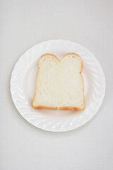 sliced loaf of bread on a white plate 