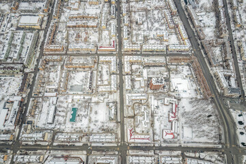 City panorama from the height of the drone flight. Residential area of brick houses in the winter. Aerial view. Nizhny Tagil, Russia