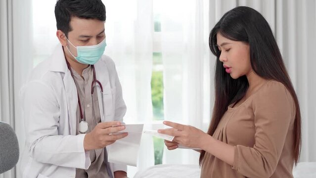 Asian pregnant woman visit gynecologist doctor at hospital for pregnancy consultant