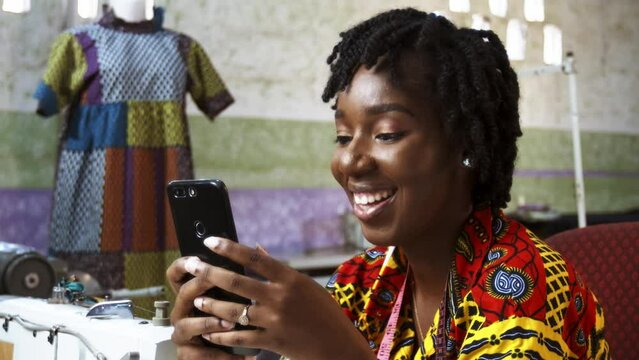Beautiful Female Black African Fashion Designer on Video Call with Client