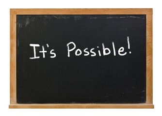 Obraz premium It's possible written in white chalk on a black chalkbolard isolated on white