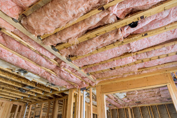 Insulation that is provided by mineral fiber glass wool between beams that form wall will be...