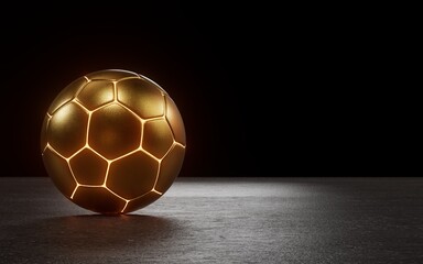 An illuminated soccer ball in gold material is on the concrete floor with dark background