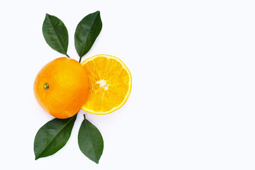 Orange fruit with green leaves on white background.