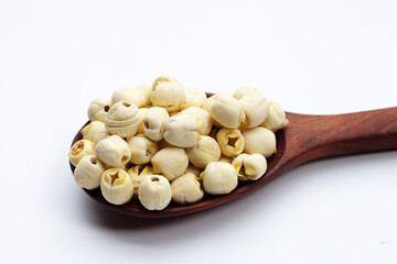 Dried lotus seeds on white background.
