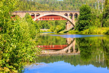 Nikolsky Stone Railway Bridge is one of the main decorations on the road from Sim to Asha on a sunny summer day.
