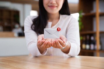 Asian teenager showing email with notification alert, Online communication concept.