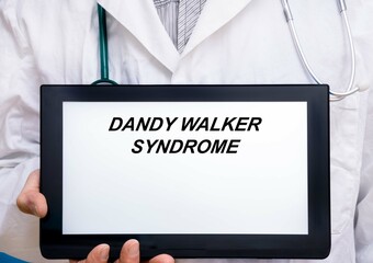 Dandy Walker Syndrome.  Doctor with rare or orphan disease text on tablet screen Dandy Walker...