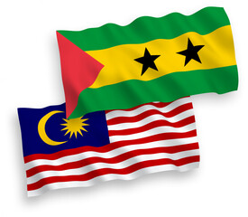 National vector fabric wave flags of Saint Thomas and Prince and Malaysia isolated on white background. 1 to 2 proportion.
